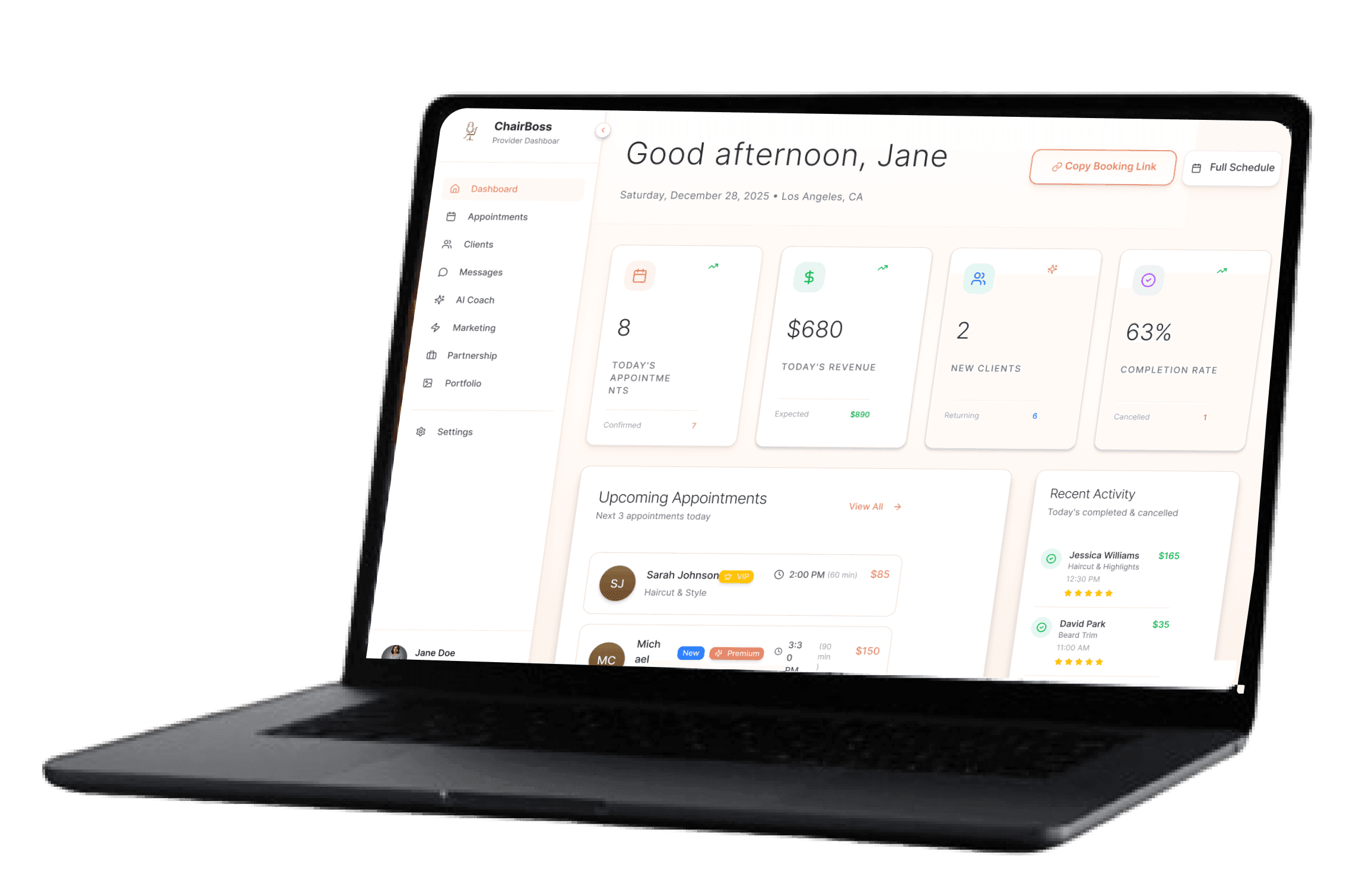 Black laptop displaying a business dashboard with metrics and 'Good afternoon, Jane' message.